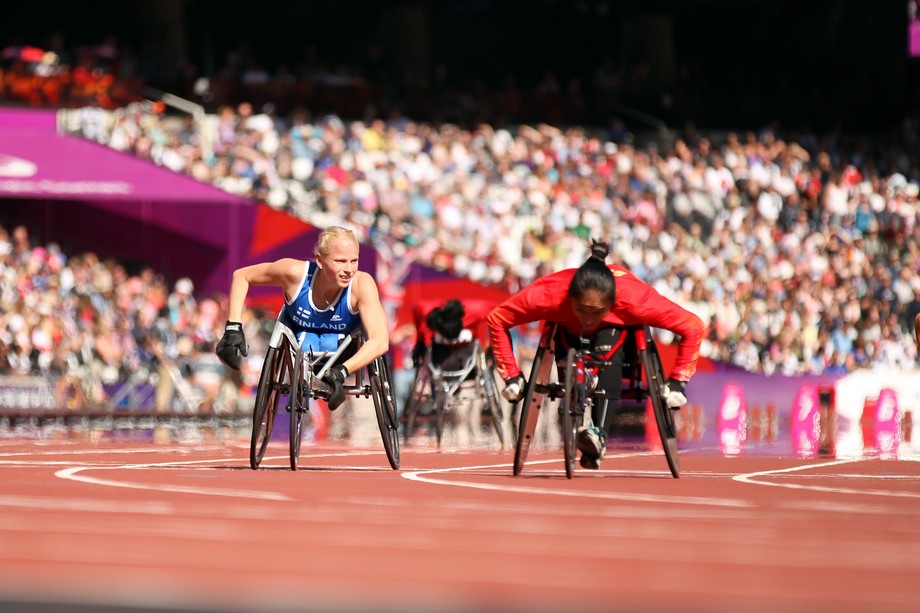 Wheelchair racers competing side by side.