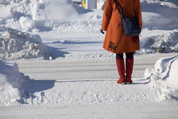 a woman is walking on the street.