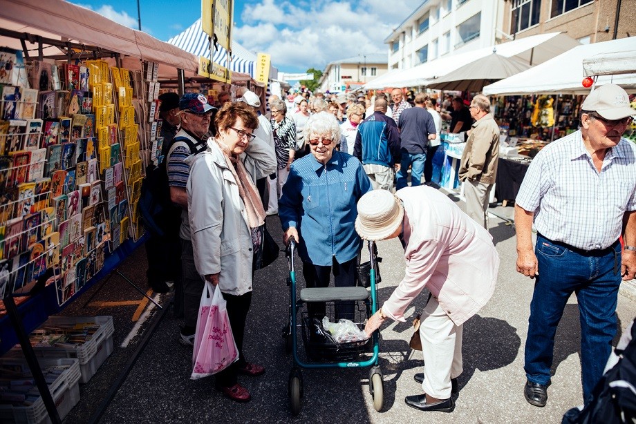 Older people meeting each other at the market place.