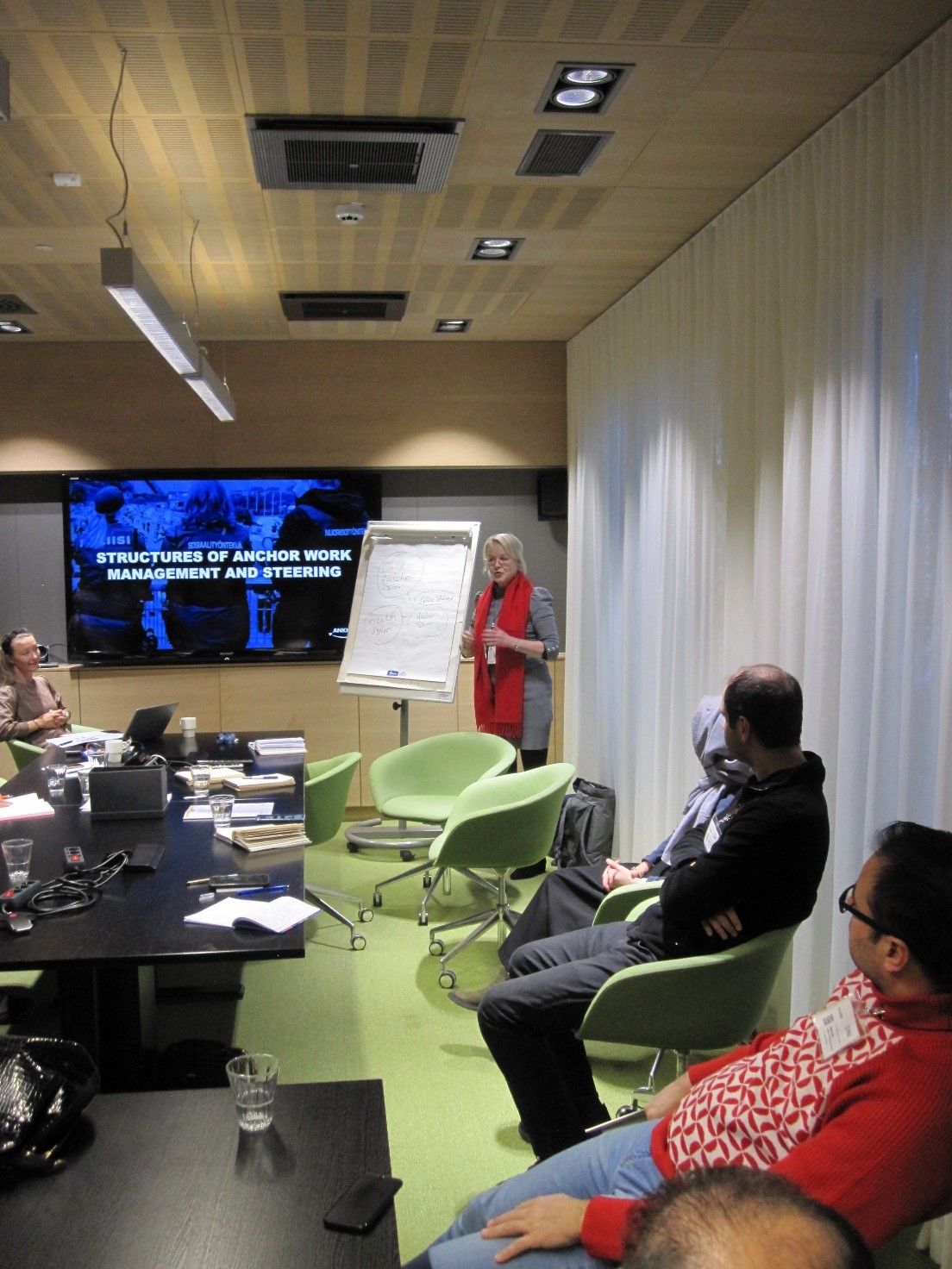 Senior specialist Emilia Hämäläinen, Ministry of the Interior (left) and Development Manager Minna Sinkkonen , THL (right) presenting the Anchor-model.