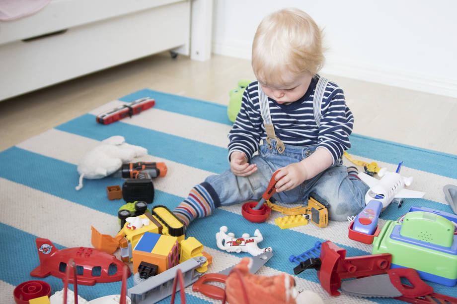 a small child playing with toys.