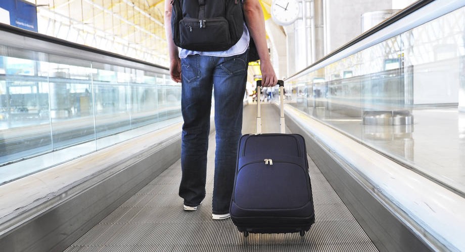 a man with a bag at the airport.