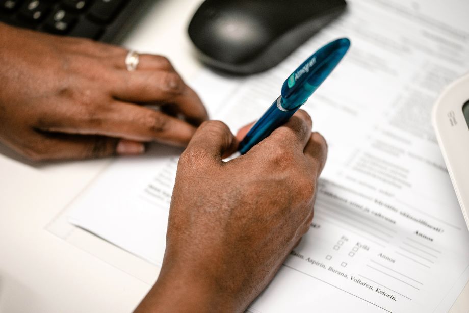 A man is filling in a form.